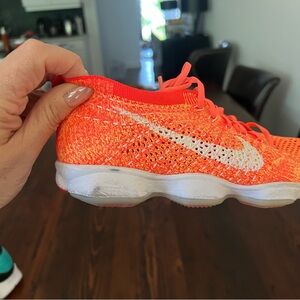 Nike Orange and White Sneakers with Flyknit Design